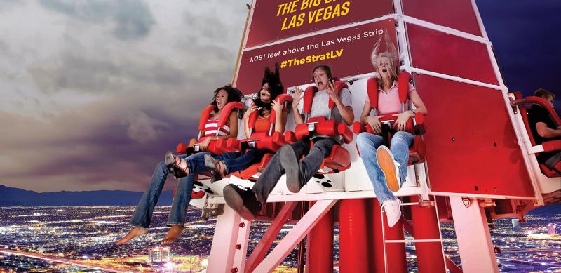 People on vertical thrill ride